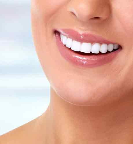 Wide and Beautiful Smile of a Young Woman With Clean Skin and White Teeths